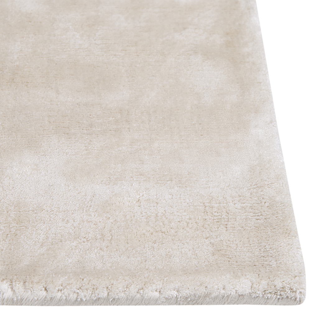 Tappeto in viscosa beige chiaro 80 x 150 cm a pelo corto capitonné moderno