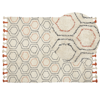 Tappeto in cotone beige e arancione 140 x 200 cm con frange e motivo geometrico camera da letto soggiorno stile boho