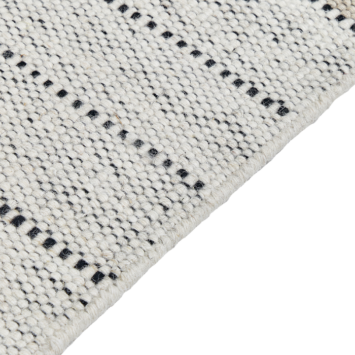 Tappeto beige e nero lana cotone 140 x 200 cm intrecciato a mano rettangolare con frange