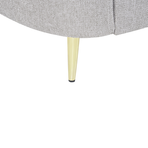 Poltrona in tessuto grigio con gambe curve dorate e seduta morbida stile glamour elegante salotto