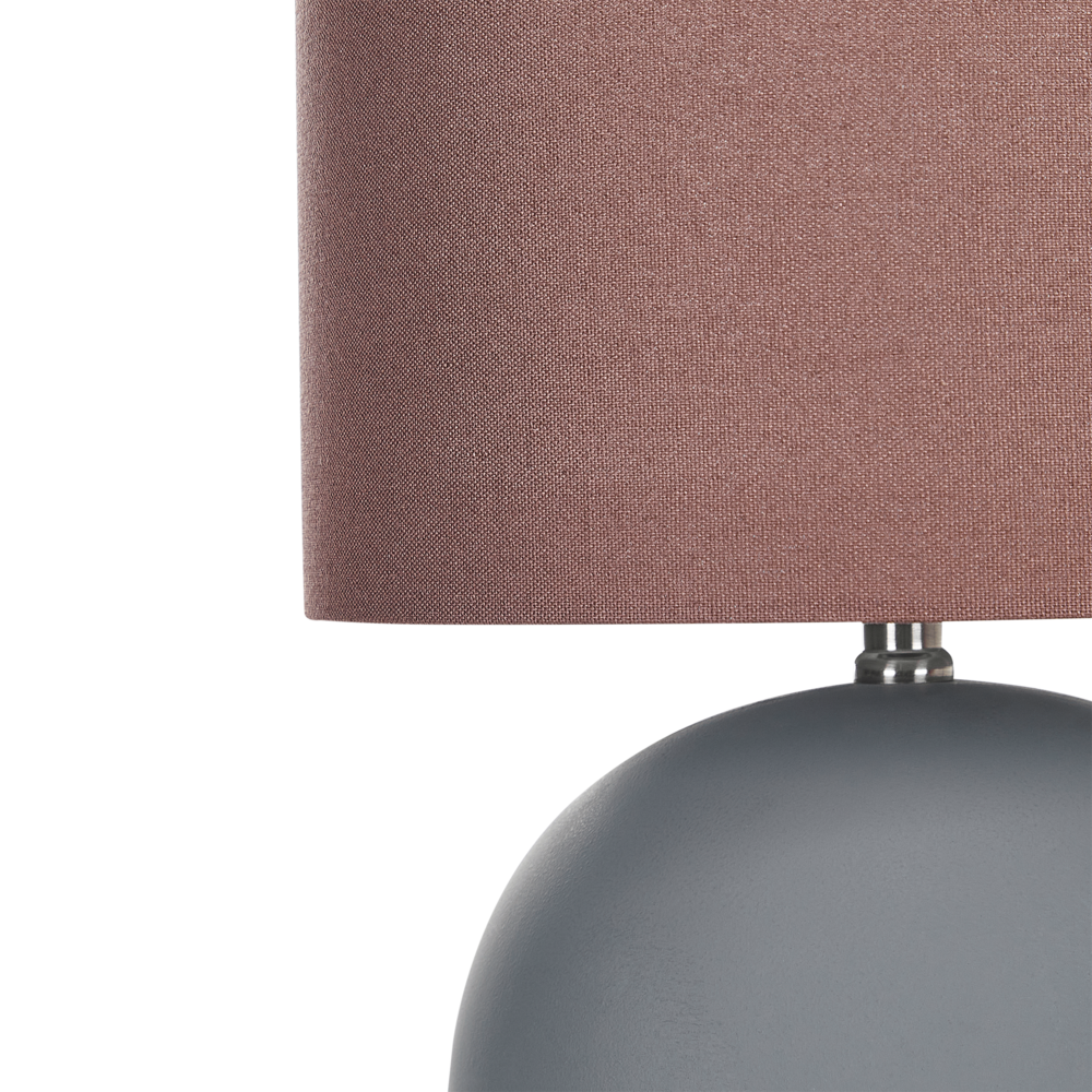 Lampada da tavolo in ceramica grigia con paralume a tamburo in lino e base rotonda stile design contemporaneo