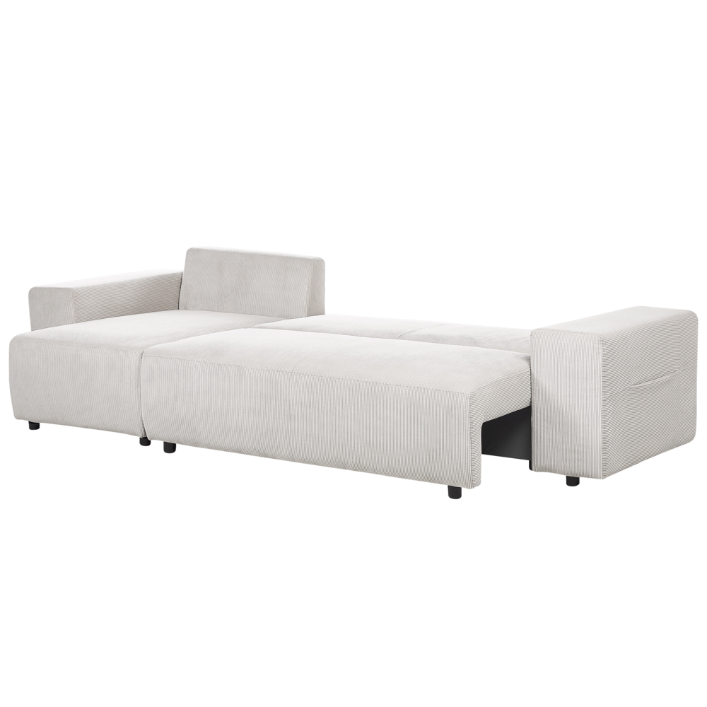 Divano angolare a destra in velluto a coste beige chiaro a 3 posti con cuscini extra sparsi Soggiorno moderno