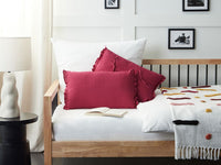 Set di 2 cuscini decorativi in lino rosso 30 x 45 cm con balze e fiocchi