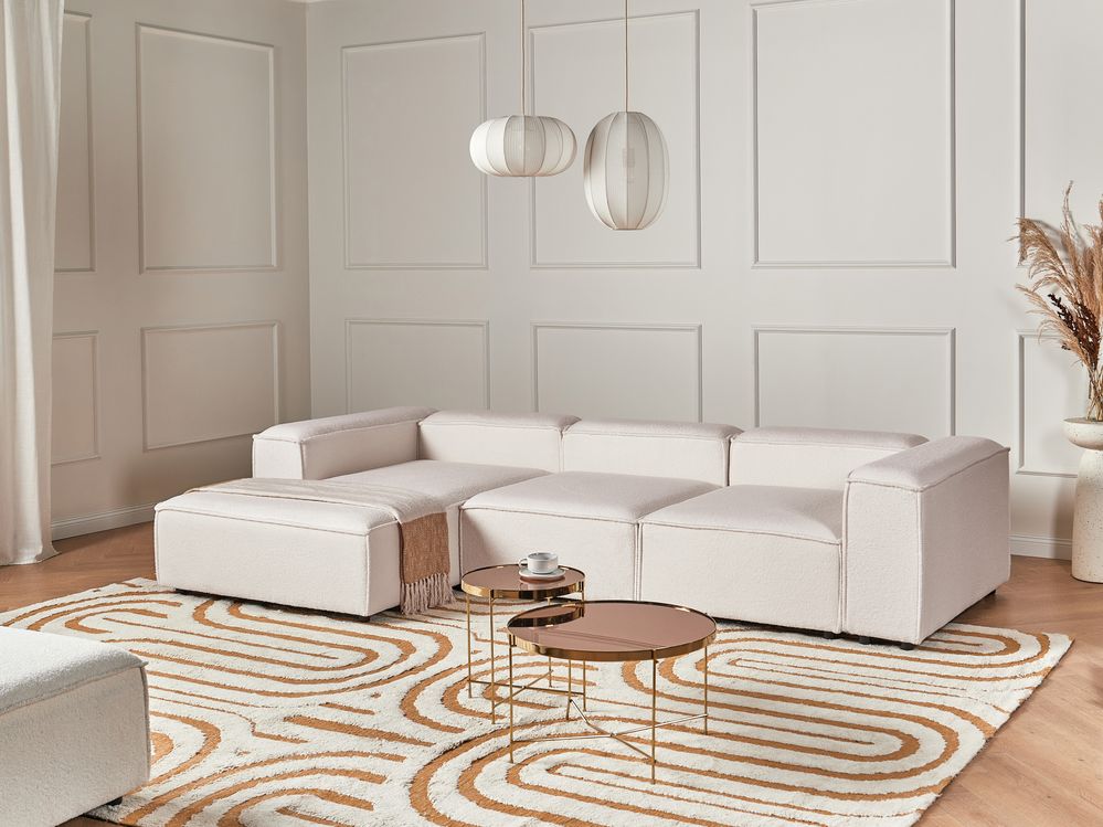 Divano moderno lato destro a 4 posti in tessuto bouclè bianco sporco e stile moderno contemporaneo