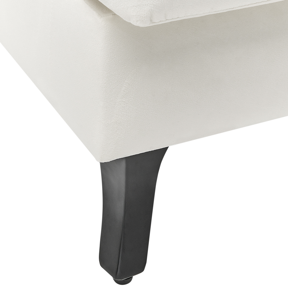 Poltrona imbottita in velluto bianco sporco gambe nere stile retrò