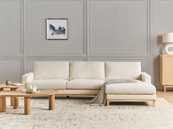 Divano angolare sinistro Rivestimento in bouclé bianco Gambe in legno Elegante