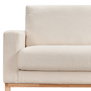 Divano angolare sinistro Rivestimento in bouclé bianco Gambe in legno Elegante