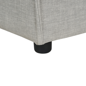 Ottomana imbottita in tessuto beige di forma quadrata con gambe nere stile moderno