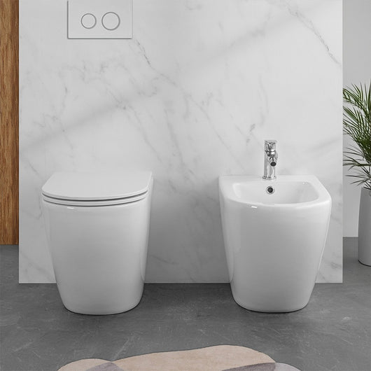 Wc e bidet filomuro per anziani con scarico traslato serie Comoda